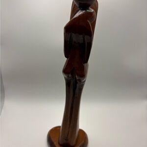 Vintage Mid-Century Modern abstract wooden sculpture depicting a romantic couple